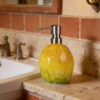Ceramic dispenser decorated in the shape of a lemon