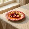 Red dessert plate with daisies