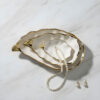 ostriche-oro-ambientata-perle Large gold oyster