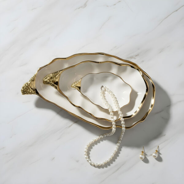 ostriche-oro-ambientata-perle Large gold oyster